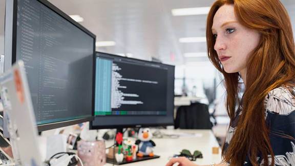 Female ingeneer working on code