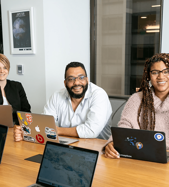 Coworkers talking around table