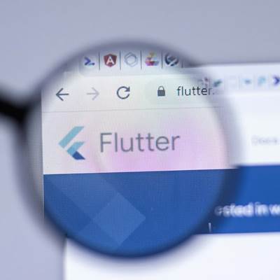 Magnifying glass over screen with Flutter logo