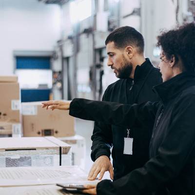 People checking stock at a warehouse