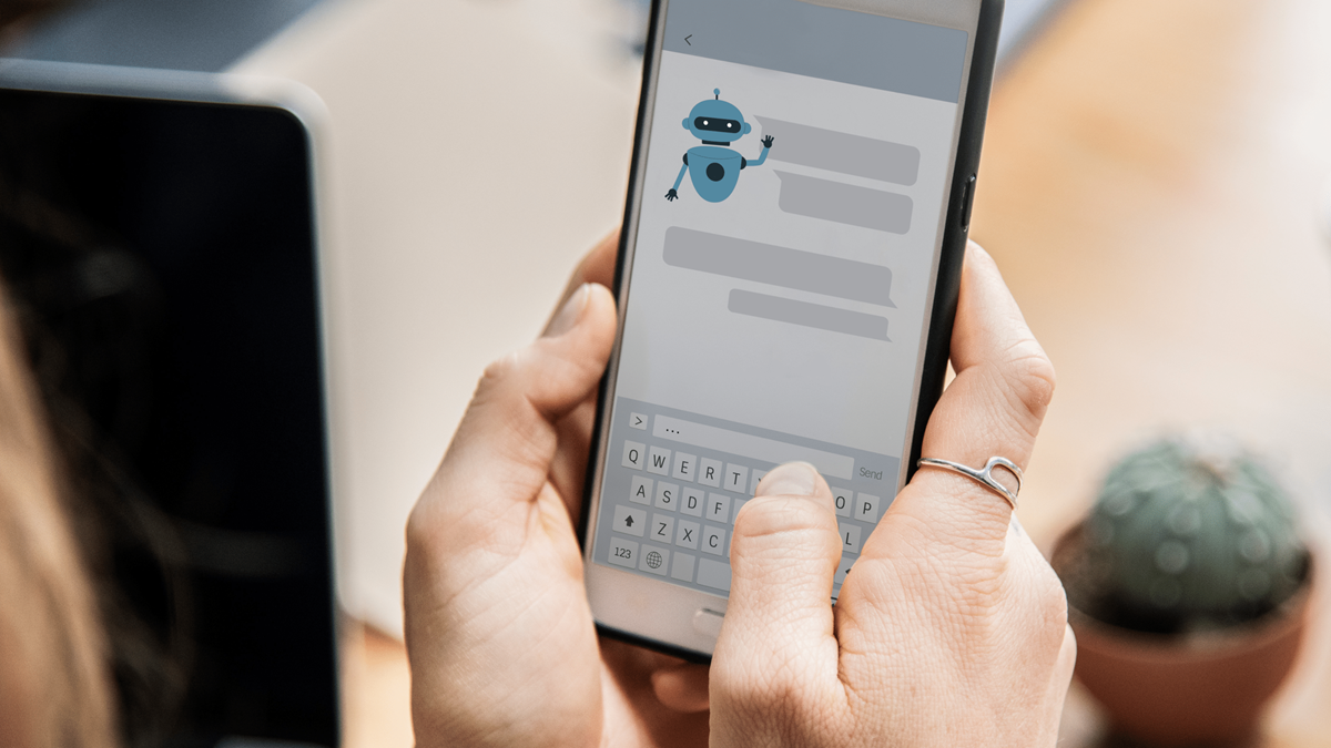 person holding phone talking to a chatbot