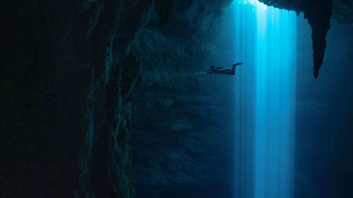 Diver exploring a submarine cave