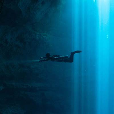Diver exploring a submarine cave