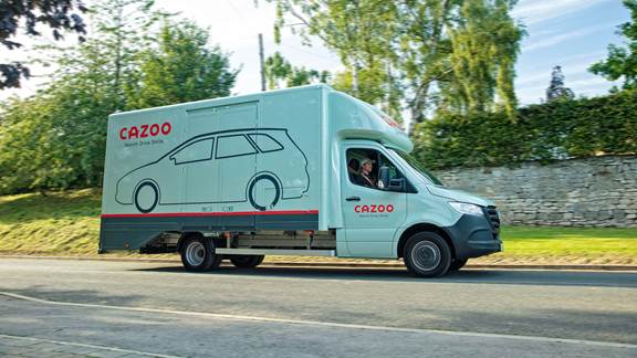 Cazoo transporter driving on country road