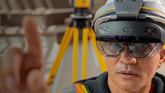 Engineer with smart helmet device interacting with augmented reality