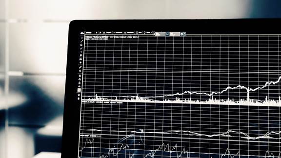 Graph charting upwards on laptop screen